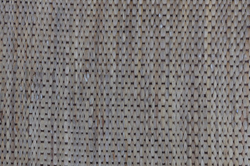 closeup detail of knitted fabric weaving mat or pad for table protection from heat ,background texture.
