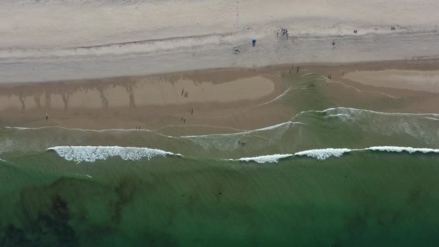 The cold waters of the Atlantic Ocean bathe a scenic beach on Cape Cod, Massachusetts. This beautiful area of New England, not too far from Boston, is a popular summer vacation destination.