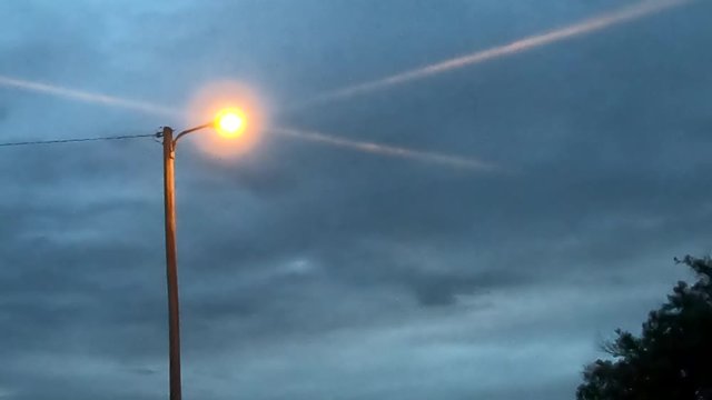 A street light on early in the morning before the sun comes up in Alberta Canada.