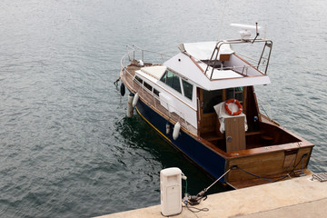 Recreational old wooden yacht moored on the pier