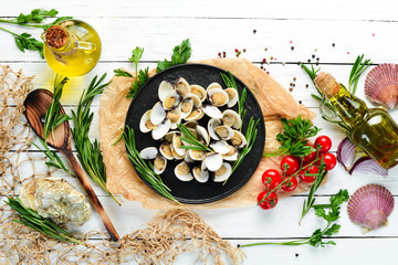 Boiled clams in a plate. Seafood on a white background.