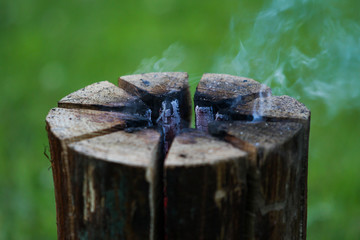 Beautiful countryside summer celebration view of burning wood from middle.