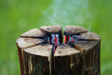 Beautiful countryside summer celebration view of burning wood from middle.