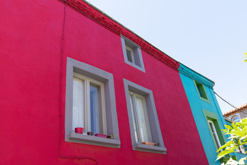 Fototapeta na wymiar pink and blue colors houses in village of Trentemoult at Nantes France