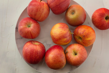 Red ripe apples on a plate