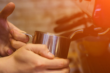 Fototapeta na wymiar Barista making coffee with coffee machine in cafe