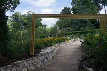 Paved path in nature with surrealist frames
