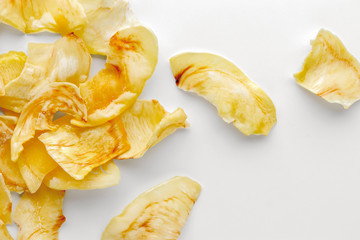 Crispy durian chips on a white background, creative flat lay food concept, top view with clipping path