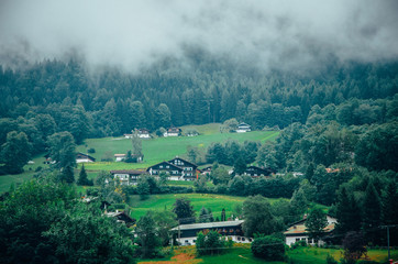 Fototapeta premium Swiss rural alps landscape in misty summer morning