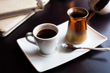 beautiful coffee house in an interesting cozy design-on the table a candle, coffee and turka