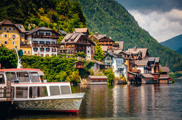 Naklejka premium Hallstatt, Austria, Boat and Houses in Famous touristic place