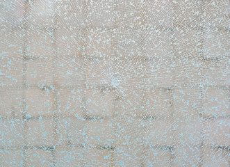 Obraz premium Cracked glass in the shop window