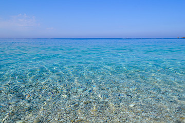 Fototapeta na wymiar Beautiful sea view. Calm azure sea with breezes of the sun on the water. Mediterranean Sea