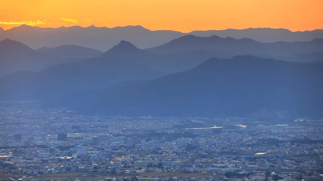 Ueda city and mountains of Northern Alps at sunset,  Japan