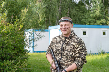 Man playing in lasertag shooting game, man with a gun, war simulation.