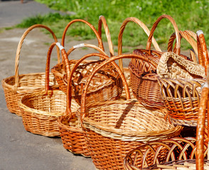 Many wicker baskets lie on the road