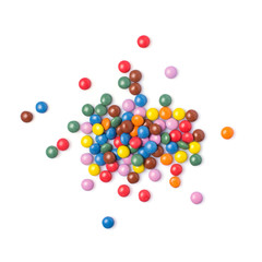 Scattered multicolored dragee isolated on white