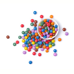 Sweet multicolored dragee in white bowl