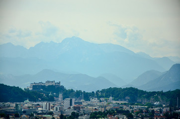 Salzburg City and Alps hills in background, white edit space