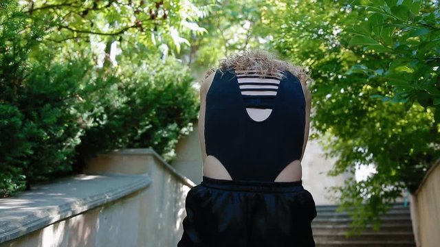 Woman doing bearhing exercise outdoors