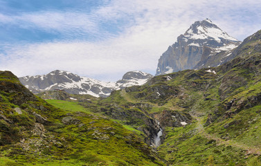 Fototapeta premium Beautiful valley in the way to Rifugio Benevolo with Granta Parey Peak at background, Val d'Aosta, Italy