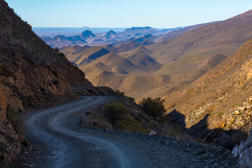 Winding gravel track in the mountains