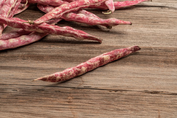 fresh kidney beans on a wooden table