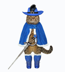 The cat musketeer in a blue cloak, a hat with a feather and boots has a sword. White background. Isolated.