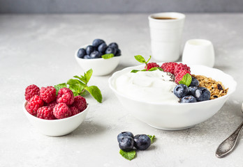 Natural greek yogurt, homemade granola and fresh berries (blueberries and raspberries). 