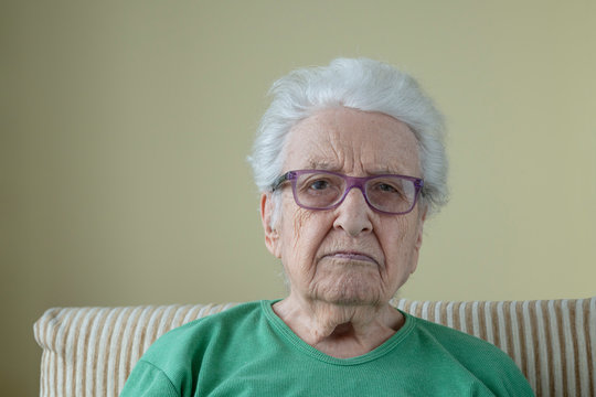 A senior woman wearing eyeglasses