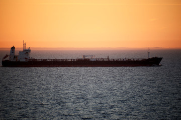 sunset above ocean while cruising through sea