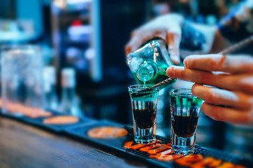 Colorful shots at the club. Shots at the bar table
