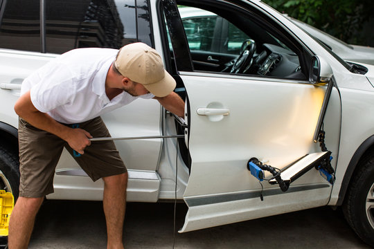 Repairing Car Dent After The Accident By Paintless Dent Repair