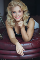 Obraz premium Beautiful Curly Hair. Smiling Girl With Healthy Wavy Long Blonde Hair. Portrait Happy Woman With Beauty Face, Sexy Makeup And Perfect Hair Curls. Volume, Hairstyle, Hairdressing Concept.