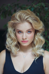 Beauty studio blonde woman portrait. Perfect skin, nude make-up, blonde hair style. Skincare facial treatment female health concept. Isolated