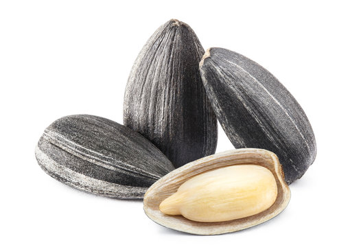 Close-up of delicious sunflower black seeds, isolated on white background