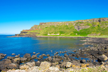 Fototapeta na wymiar Giants Causeway on Coast of Atlantic Ocean in Northern Ireland. Beautiful landscape, summer time