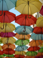 Fototapeta na wymiar Colorful umbrellas ceiling on sunny day
