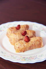 traditional Turkish Arabian oriental sweetness baklava on white plate