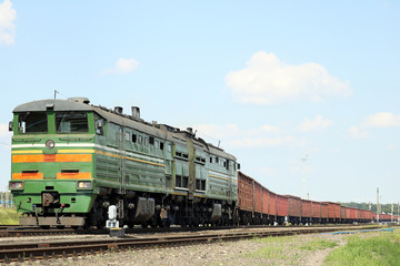 Fototapeta premium diesel locomotive with freight train 