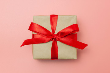 Gift box or present wrapped with red bow