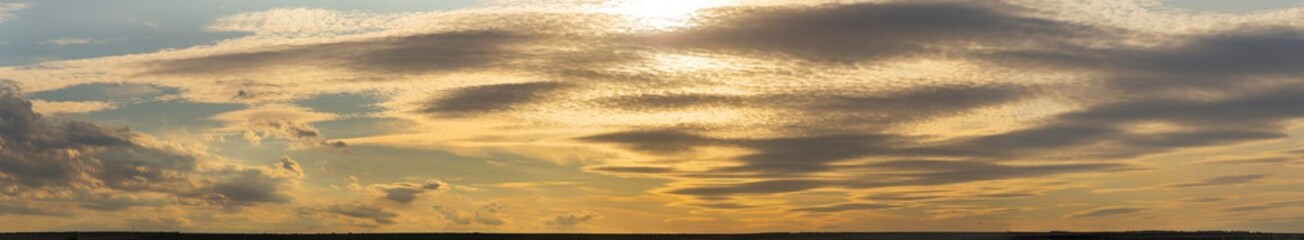Leaden, storm clouds covered the sunset. Cumuliform cloudscape on blue sky. The terrain in southern Europe. Fantastic skies on the planet earth. Tragic gloomy sky.	
