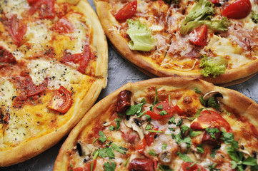Delicious pizza on stone background.