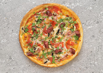 Delicious pizza on stone background.