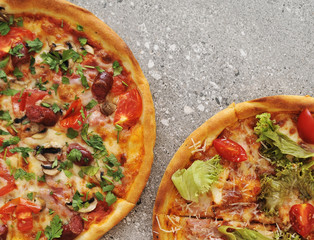 Delicious pizza on stone background.