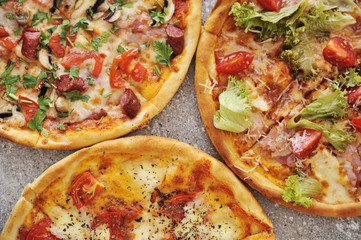 Delicious pizza on stone background.