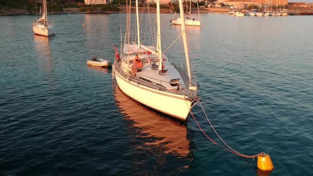 Sailing boat moored at sunset