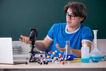 Young male student in the classroom