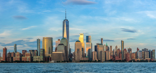 View to Lower Manhattan Skyline from Exchange Place in Jersey City at sunset.