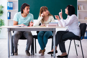 Old teacher and students in the classroom